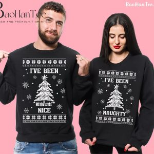 Couple wearing matching Christmas sweaters with 'I've Been Nice' and 'I've Been Naughty' designs