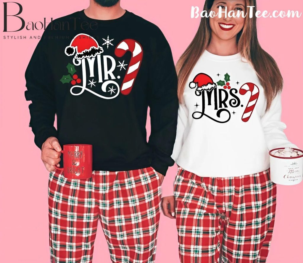 Matching Mr. and Mrs. Christmas sweaters with candy cane and Santa hat designs