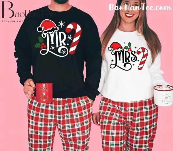 Matching Mr. and Mrs. Christmas sweaters with candy cane and Santa hat designs