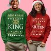 Couple wearing King and Queen Christmas sweaters with crowns