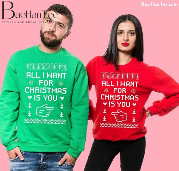 Couple wearing 'All I Want for Christmas Is You' matching Christmas sweaters