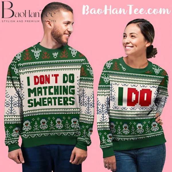 Couple wearing green Christmas sweaters with 'I Don't Do Matching Sweaters' and 'I Do' designs