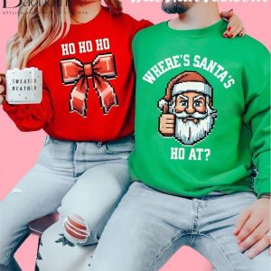 Couple wearing Christmas sweaters with 'Ho Ho Ho' bow design and 'Where’s Santa’s Ho At?' Santa design