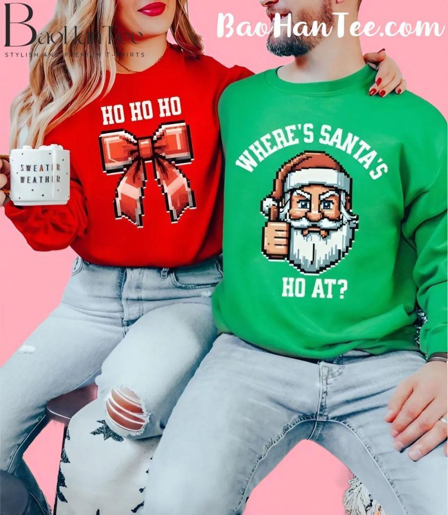 Couple wearing Christmas sweaters with 'Ho Ho Ho' bow design and 'Where’s Santa’s Ho At?' Santa design